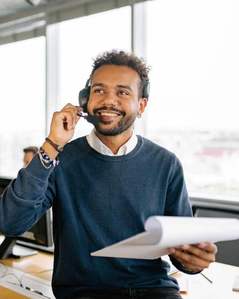 Man answering a call in a call center