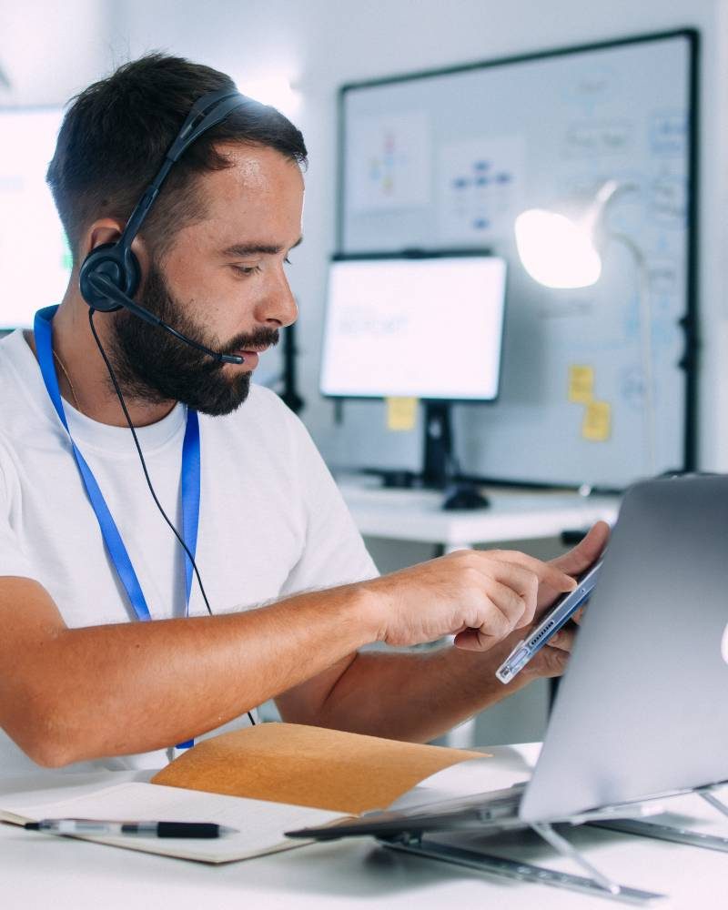 Man answering a call in a call center